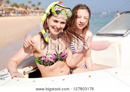happy young girl loves summer vacation on the ocean cruise on a boat