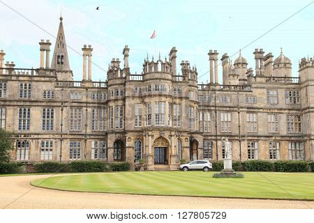 STAMFORD, ENGLAND - JUNE 14, 2014: Burghley House on June 14, 2014 in Stamford, England. It is a landmark medieval castle in Central England.