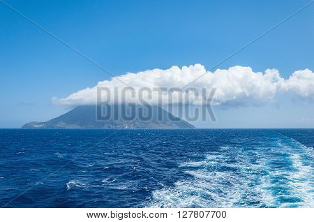 Stromboli island with cloud on the top. Italy.