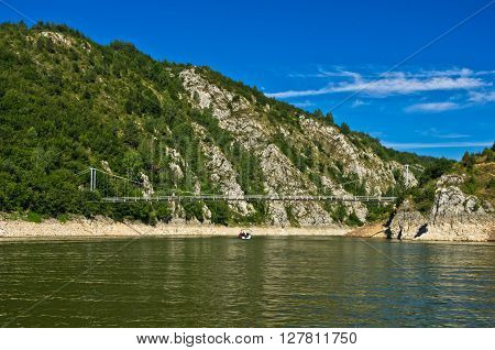 Landscape with pedestrian bridge at river Uvac gorge, southwest Serbia