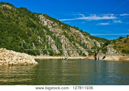 Landscape with pedestrian bridge at river Uvac gorge, southwest Serbia