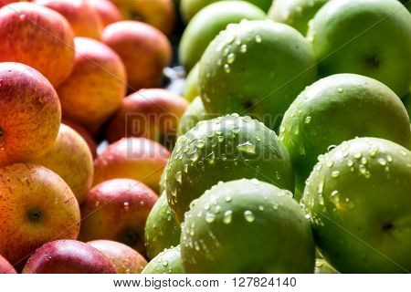 Yellow organic apples and Green organic apples in baskets