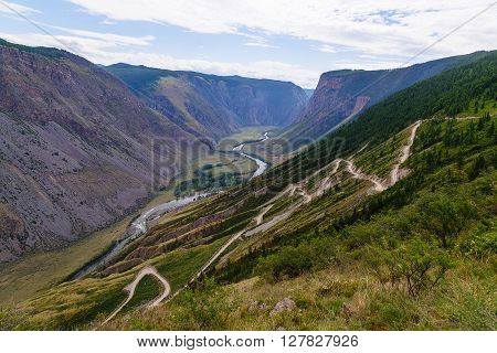 serpentine mountain road on pass Chulyshman Gorny Altai