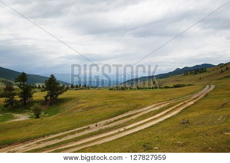 gravel road in a mountain valley at top. Altai Mountains Summer