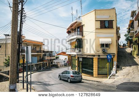 THESSALONIKI, GREECE - MAY 27, 2015: Small houses with sea view in the upper part of the city of Thessaloniki. Steep streets and crossroads on the hill.