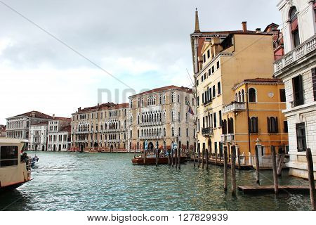 On the photo shows the architecture of Venice, canals, bridges and buildings!