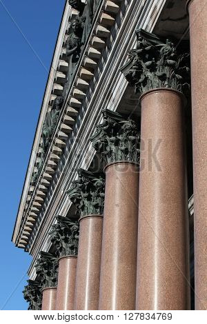 columns with decorated chapiter background blue sky