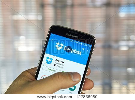 MONTREAL CANADA - APRIL 7 2016 : Dropbox application on a cell phone. Dropbox is a file hosting service operated by Dropbox Inc.