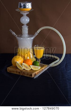 still life of a hookah , which stands on a wooden delivery , orange juice in a glass glass , a lemon , lime and orange as design elements .
** Note: Visible grain at 100%, best at smaller sizes