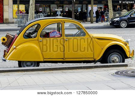 Paris, France - May 12: It is an old yellow Citroen Citroen 2 CB the legend of the French car industry outdoors May 12, 2013 in Paris, France.
