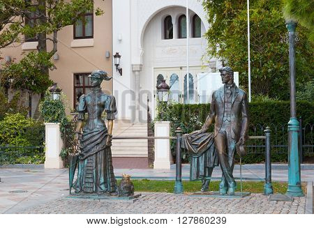 RUSSIA YALTA - SEPTEMBER 24 2015: Sculpture Anton Chekhov and the Lady with Dog in Yalta Crimea