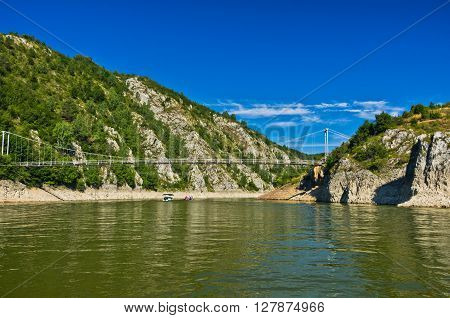 Landscape with pedestrian bridge at river Uvac gorge, southwest Serbia