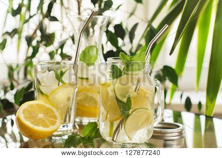 Homemade lemonade in mason jar over summer background, selective focus