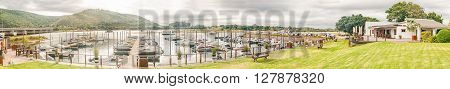 PLETTENBERG BAY SOUTH AFRICA - MARCH 3 2016: The harbor of the Plettenberg Bay Angling Club is situated on the down stream side of the N2 bridge on the Keurbooms River