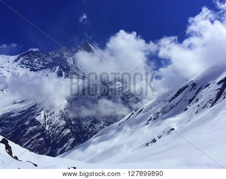 Panorama of snow mountains near Annapurna, summer day in Himalayas, Himalayan peaks under sun, summer snow, trekking to Annapurna, cold summer, snow trekking path, peaks of Himalaya, Nepal