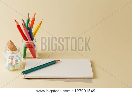 Homework Workplace With Color Pencil An Mpti Notepad