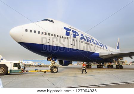 MOSCOW RUSSIA - SEPTEMBER 26 2014: Boeing 747 Transaero towed to the runway. Transaero Airlines has ceased to exist in 2015.