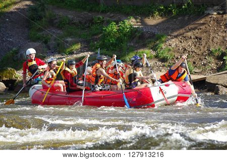 LOSEVO - AUGUST 18: Whitewater rafting on AUGUST 18 2012 RUSSIA. Unidentified persons enjoy whitewater rafting on the Vuoksi river in Losevo Leningrad region Russia
