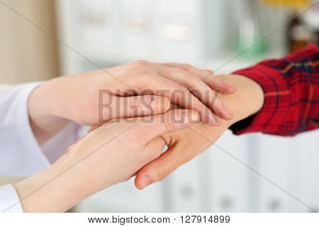 Woman Doctor Hands Holding Female Child Patient Hand