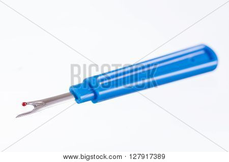 Blue seam ripper isolated on white background