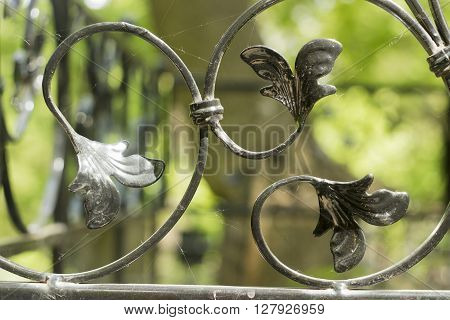 Decorative ornament made of old metal on the fence