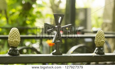 Decorative ornament made of old metal on the fence