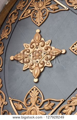 Decorative ornament made of old metal on the fence