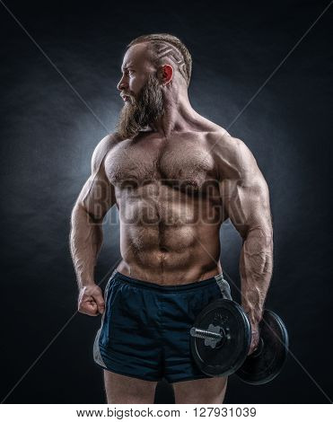 Strong Bodybuilder With Six Pack, Perfect Abs, Shoulders, Biceps, Triceps And Ches