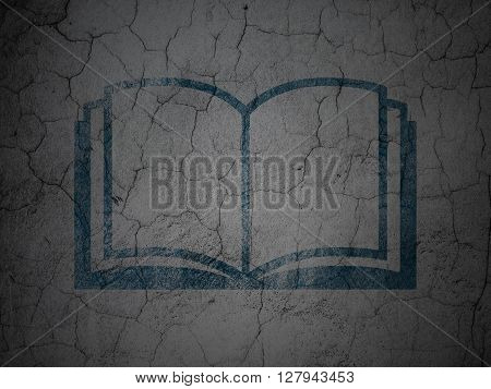 Learning concept: Blue Book on grunge textured concrete wall background