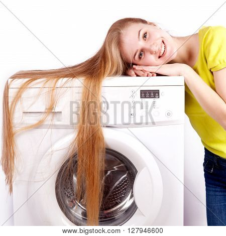 Young beautiful woman using a washing machine