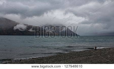 Summer scene at Lake Ohau South Island. Dramatic sky.
