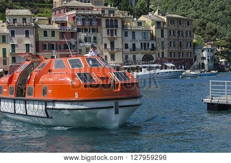 Portofino Italy - May 29 2015: helmsman moors with the ship for the transport of passengers.