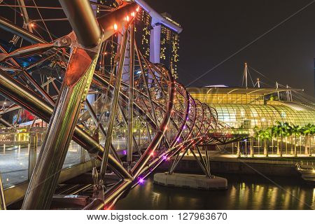 SINGAPORE - SEPTEMBER 28, 2013 : Marina Bay Sands and Helix bridge lighting show, a famous landmark of Singapore.