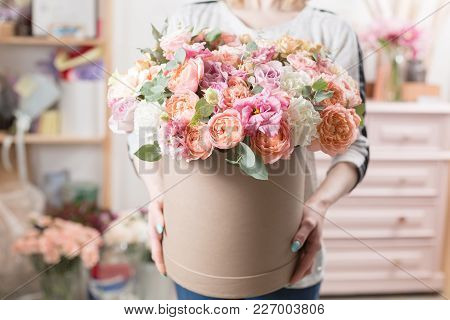 Beautiful Luxury Bouquet Of Mixed Flowers In Woman Hand. The Work Of The Florist At A Flower Shop. C