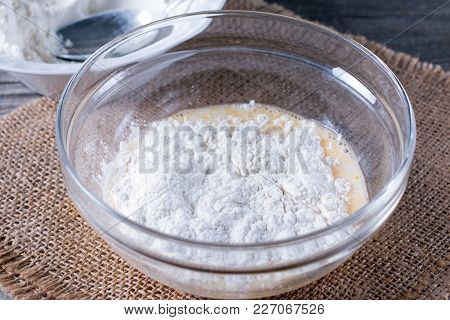 Preparing A Dough/batter For Crepes Or Pancakes With Wheat Flour In Glass Bowl, Milk, Eggs