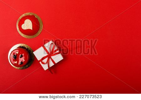 Present On A Bright Red Background With A Copy Space
