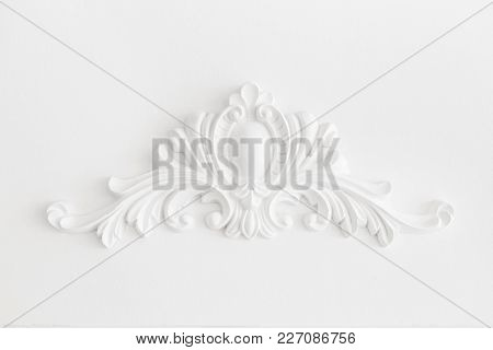 Expensive Interior. Stucco Elements On Light Luxury Wall. White Patterned. Mouldings Element From Gy