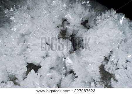 Background: A Section Of The Cave Wall Covered With Large Crystals Of Ice