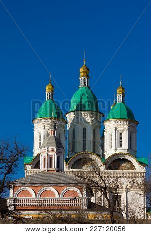 Astrakhan. Cathedral Of The Assumption Of The Blessed Virgin Mary. Golden Domes On A Background Of T