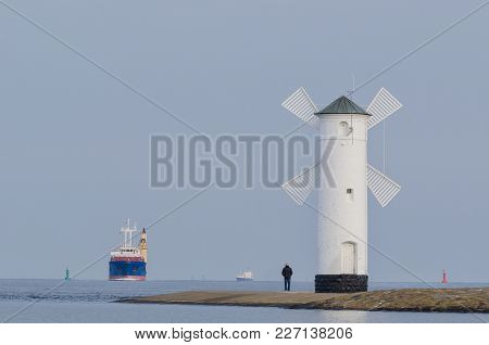 Seascape - Navigation Mark And Freighter Sailing On The Sea