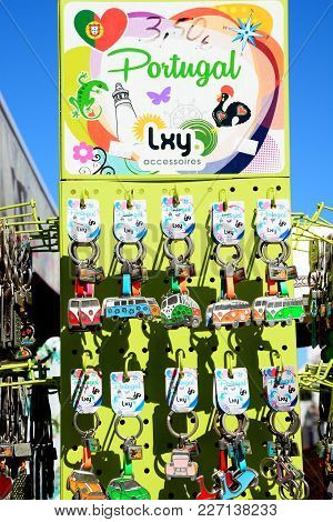 Alvor, Portugal - June 7, 2017 - Display Rack Of Car Key Rings Outside A Village Shop, Alvor, Algarv