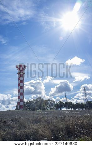 Irrigation Water Tank Over Blue Sky. Concrete Tower Made For Store Irrigation Water, Vegas Bajas Del