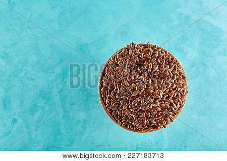 Nutricious Flax Seeds In A Clay Bowl Isolated On White Background. Close-up, Selective Focus, Vertic