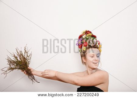 A Young Womaa Young Woman With Flowers On Her Head And Hands. Spring Image With Flowers. Man With A 