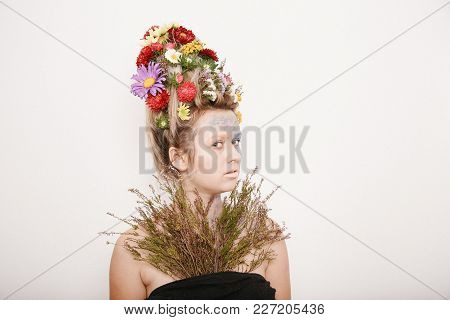 A Young Womaa Young Woman With Flowers On Her Head And Hands. Spring Image With Flowers. Man With A 