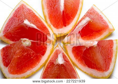 Grapefruit Slices Isolated On The White Background.