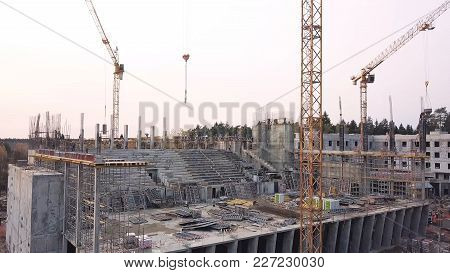 Top View See The Construction Site Of Reinforced Concrete High-rise Building. Clip. Top View Of A Bu
