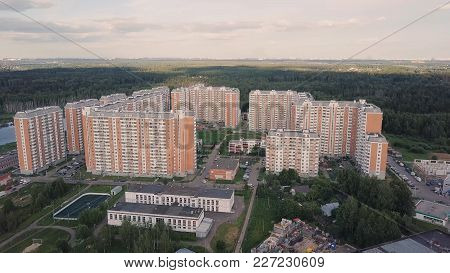 Aerial View Apartment Buildings Complex And Residential Houses Neighborhood. Clip. Top View Of The M