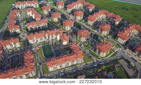 Aerial View Apartment Buildings Complex And Residential Houses Neighborhood. Clip. Top View Of The M