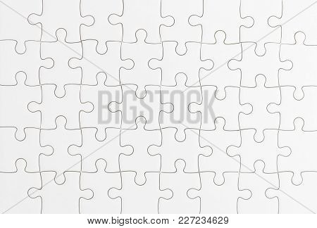 Close Up Top View Shot Of White Jigsaw Puzzel Background